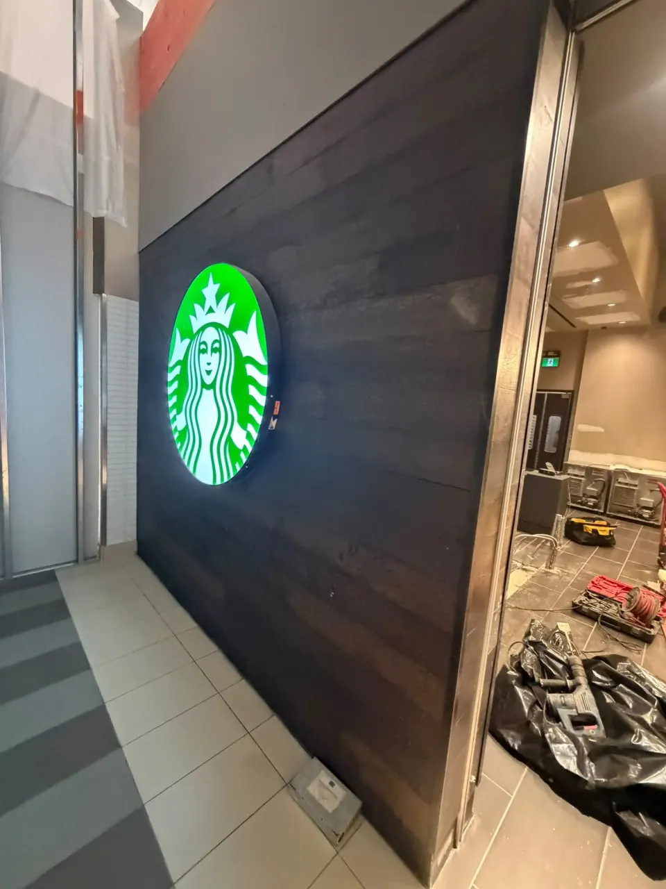 Dark cladding installed on the commercial interior wall