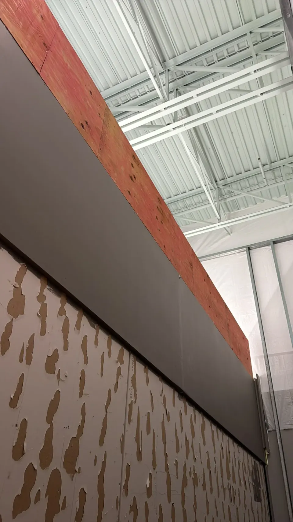Upper commercial wall before dark cladding was installed