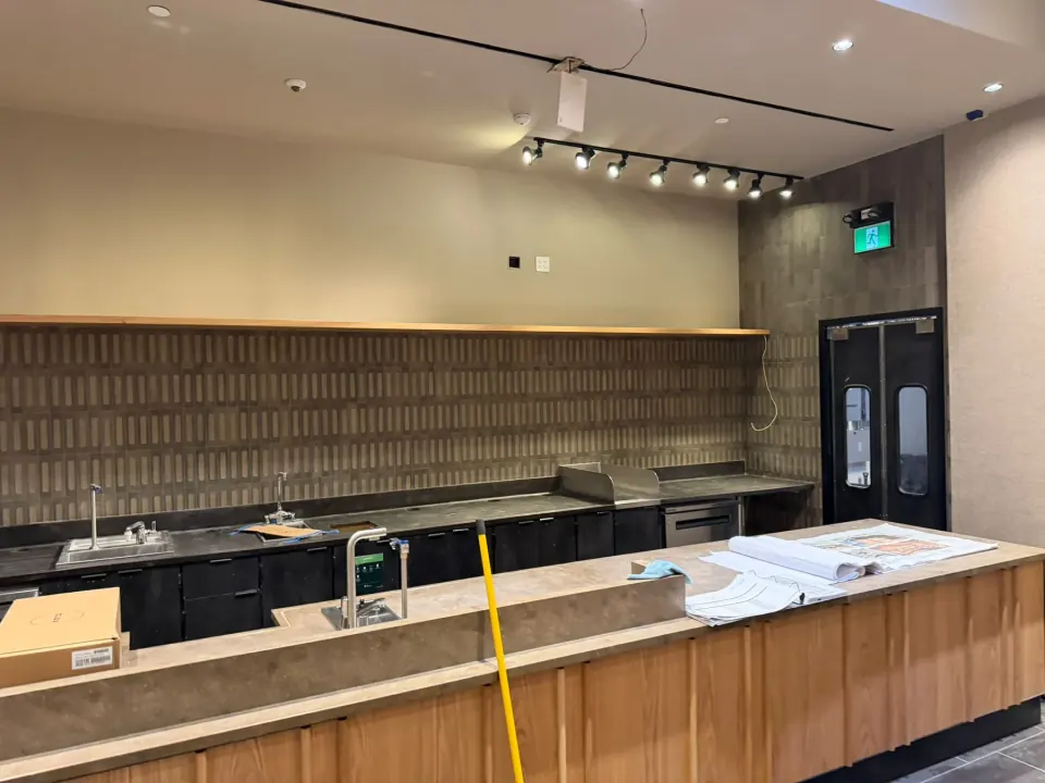 Service counter with wood front and finished wall surfaces